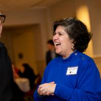 Samhita Rhodes laughing with a colleague